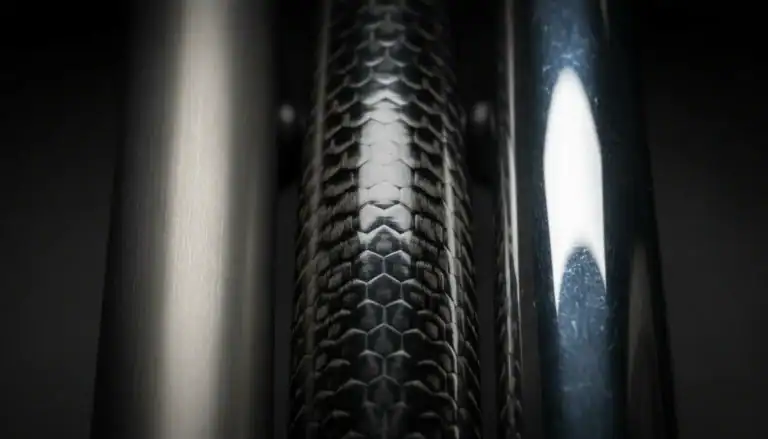 Carbon fiber bike frame close-up showing material texture and weave pattern